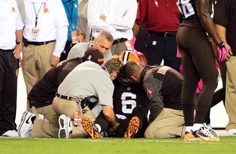 Oct 3, 2013; Cleveland, OH, USA; Cleveland Browns quarterback Brian Hoyer (6) is attended to by medical staff after being injured during the Oct 3, 2013; Cleveland, OH, USA; Cleveland Browns quarterback Brian Hoyer (6) is attended to by medical staff after being injured during the