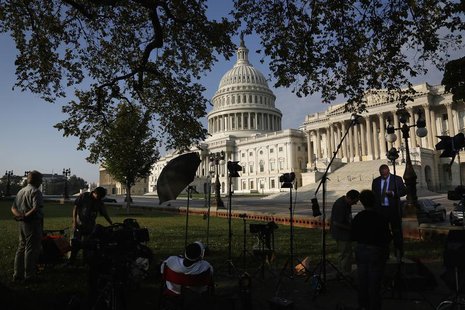 Television news crews set up outside the U.S. Capitol in Washington, October 4, 2013. REUTERS/Jonathan Ernst Television news crews set up outside the U.S. Capitol in Washington, October 4, 2013. REUTERS/Jonathan Ernst