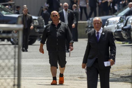 Celebrity chef Mario Batali walks outside the Cathedral Church of Saint John the Divine in New York June 27, 2013, following the funeral ser Celebrity chef Mario Batali walks outside the Cathedral Church of Saint John the Divine in New York June 27, 2013, following the funeral ser