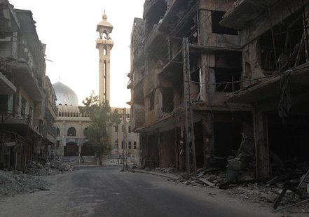 A general view shows damaged buildings along a deserted street in the Damascus suburb of Zamalka September 30, 2013. REUTERS/Stringer A general view shows damaged buildings along a deserted street in the Damascus suburb of Zamalka September 30, 2013. REUTERS/Stringer