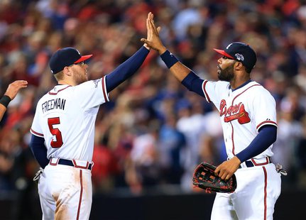 Oct 4, 2013; Atlanta, GA, USA; Atlanta Braves center fielder Jason Heyward (22) celebrates with first baseman Freddie Freeman (5) after defe Oct 4, 2013; Atlanta, GA, USA; Atlanta Braves center fielder Jason Heyward (22) celebrates with first baseman Freddie Freeman (5) after defe