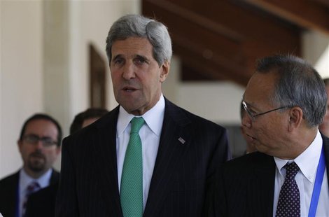 U.S. Secretary of State John Kerry (C) talks with Robert Wang (R), the U.S. Deputy Chief of Mission in China, during the Asia Pacific Econom U.S. Secretary of State John Kerry (C) talks with Robert Wang (R), the U.S. Deputy Chief of Mission in China, during the Asia Pacific Econom