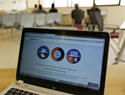 A busy screen is shown on the laptop of a Certified Application Counselor as he attempted to enroll an interested person for Affordable Care A busy screen is shown on the laptop of a Certified Application Counselor as he attempted to enroll an interested person for Affordable Care