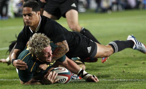 South Africa's captain Jean de Villiers scores a try as he is challenged by New Zealand's All Blacks Aaron Smith (top) during the final roun South Africa's captain Jean de Villiers scores a try as he is challenged by New Zealand's All Blacks Aaron Smith (top) during the final roun