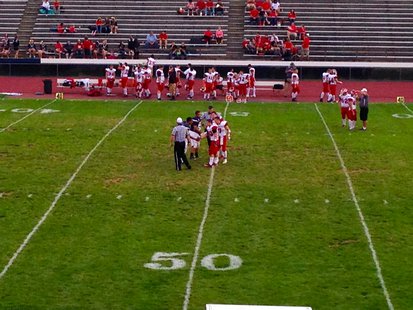 The captains for the Coldwater Cardinals and Loy Norrix Knights meet at midfield for the coin toss before their October 4, 2013 game. The captains for the Coldwater Cardinals and Loy Norrix Knights meet at midfield for the coin toss before their October 4, 2013 game.