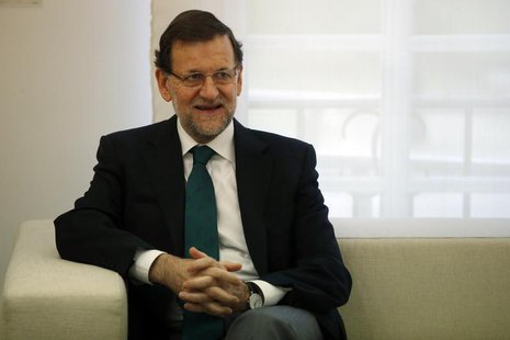Spain's Prime Minister Mariano Rajoy smiles during a meeting with Saudi Arabia Transport Minister Jubara Al Suraisry (not pictured) at Madri Spain's Prime Minister Mariano Rajoy smiles during a meeting with Saudi Arabia Transport Minister Jubara Al Suraisry (not pictured) at Madri