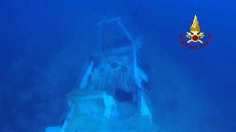 A boat which sank off the southern Italian island of Lampedusa is pictured in this still image taken from video, released by the Italian Vig A boat which sank off the southern Italian island of Lampedusa is pictured in this still image taken from video, released by the Italian Vig