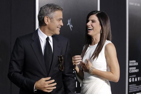 Actors George Clooney and Sandra Bullock arrive for the film premiere of "Gravity" in New York October 1, 2013. REUTERS/Andrew Kelly Actors George Clooney and Sandra Bullock arrive for the film premiere of "Gravity" in New York October 1, 2013. REUTERS/Andrew Kelly
