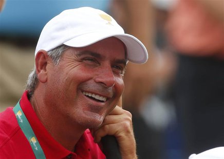 U.S. team captain Fred Couples laughs on the 18th green during the four ball matches at the 2013 Presidents Cup golf tournament at Muirfield U.S. team captain Fred Couples laughs on the 18th green during the four ball matches at the 2013 Presidents Cup golf tournament at Muirfield