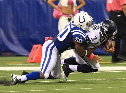 Oct 6, 2013; Indianapolis, IN, USA; Seattle Seahawks quarterback Russell Wilson (3) is sacked by Indianapolis Colts inside linebacker Jerrel Oct 6, 2013; Indianapolis, IN, USA; Seattle Seahawks quarterback Russell Wilson (3) is sacked by Indianapolis Colts inside linebacker Jerrel