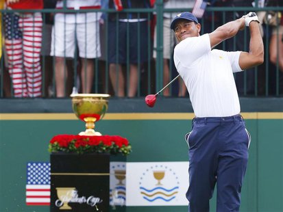 U.S. golfer Tiger Woods tees off on the first hole against International team member Richard Sterne of South Africa during the Singles match U.S. golfer Tiger Woods tees off on the first hole against International team member Richard Sterne of South Africa during the Singles match