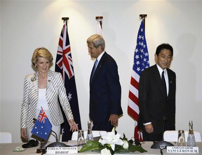 Australia's Foreign Minister Julie Bishop (L-R), U.S. Secretary of State John Kerry and Japanese Foreign Minister Fumio Kishida prepare to t Australia's Foreign Minister Julie Bishop (L-R), U.S. Secretary of State John Kerry and Japanese Foreign Minister Fumio Kishida prepare to t