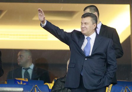 Ukrainian President Viktor Yanukovich waves before the 2014 World Cup qualifying soccer match between Ukraine and England at the Olympic sta Ukrainian President Viktor Yanukovich waves before the 2014 World Cup qualifying soccer match between Ukraine and England at the Olympic sta