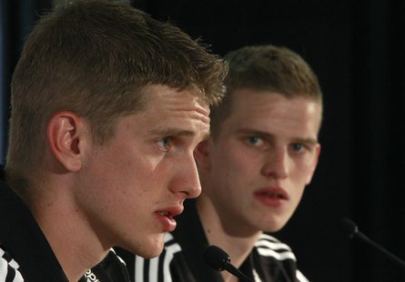 Germany's national soccer players and twins Sven (R) and Lars Bender listen during a news conference in Tourrettes, southern France, May 23, Germany's national soccer players and twins Sven (R) and Lars Bender listen during a news conference in Tourrettes, southern France, May 23,