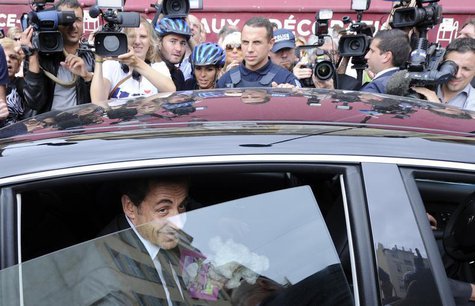 Former French president Nicolas Sarkozy leaves by car after a lunch with UMP political party members in Nice September 27, 2013. REUTERS/Oli Former French president Nicolas Sarkozy leaves by car after a lunch with UMP political party members in Nice September 27, 2013. REUTERS/Oli