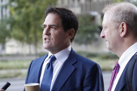 Mark Cuban (L), the billionaire owner of the NBA's Dallas Mavericks, speaks with the media while his attorney Stephen Best (R) looks on prio Mark Cuban (L), the billionaire owner of the NBA's Dallas Mavericks, speaks with the media while his attorney Stephen Best (R) looks on prio