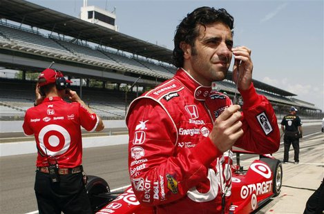 Target Chip Ganassi Racing driver Dario Franchitti of Scotland (R), prepares in pit lane during practice time at the Indianapolis Motor Spee Target Chip Ganassi Racing driver Dario Franchitti of Scotland (R), prepares in pit lane during practice time at the Indianapolis Motor Spee