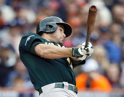 Oct 7, 2013; Detroit, MI, USA; Oakland Athletics designated hitter Seth Smith (15) hits a two-run home run in the fifth inning against the D Oct 7, 2013; Detroit, MI, USA; Oakland Athletics designated hitter Seth Smith (15) hits a two-run home run in the fifth inning against the D
