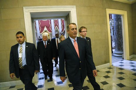 U.S. House Speaker John Boehner (R-OH) (C) returns to his office after a unanimous House vote to retroactively pay furloughed government wor U.S. House Speaker John Boehner (R-OH) (C) returns to his office after a unanimous House vote to retroactively pay furloughed government wor