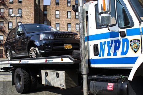 The SUV involved in Sunday's Manhattan's Henry Hudson Parkway motorcycle accident is seen on a NYPD truck arriving to the 33 precinct in New The SUV involved in Sunday's Manhattan's Henry Hudson Parkway motorcycle accident is seen on a NYPD truck arriving to the 33 precinct in New