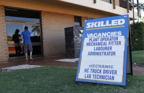 A man arrives at a compound of employment offices in Karratha at the Pilbarra region in Western Australia April 19, 2011. Picture taken Apri A man arrives at a compound of employment offices in Karratha at the Pilbarra region in Western Australia April 19, 2011. Picture taken Apri