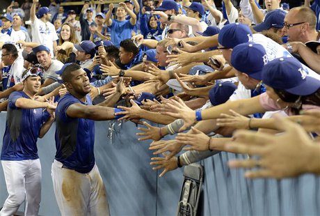 October 7, 2013; Los Angeles, CA, USA; Los Angeles Dodgers right fielder Yasiel Puig (66) celebrates the 4-3 victory against the Atlanta Bra October 7, 2013; Los Angeles, CA, USA; Los Angeles Dodgers right fielder Yasiel Puig (66) celebrates the 4-3 victory against the Atlanta Bra
