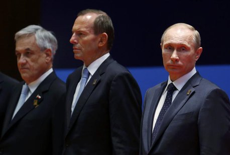 Chile's President Sebastian Pinera (L-R), Australia's Prime Minister Tony Abbott and Russia's President Vladimir Putin listen during the lea Chile's President Sebastian Pinera (L-R), Australia's Prime Minister Tony Abbott and Russia's President Vladimir Putin listen during the lea