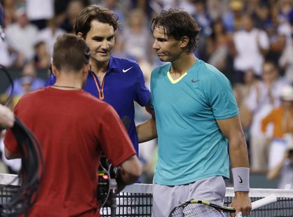 Roger Federer of Switzerland and Rafael Nadal (R) of Spain greet each other at the net after Nadal defeated Federer in their men's singles q Roger Federer of Switzerland and Rafael Nadal (R) of Spain greet each other at the net after Nadal defeated Federer in their men's singles q