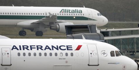An Alitalia plane passes an Air France plane on the tarmac of Charles de Gaulles International Airport in Roissy near Paris, January 8, 2013 An Alitalia plane passes an Air France plane on the tarmac of Charles de Gaulles International Airport in Roissy near Paris, January 8, 2013