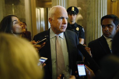 U.S. Senator John McCain talks to reporters as the Senate passes a spending bill to avoid a government shutdown, sending the issue back to t U.S. Senator John McCain talks to reporters as the Senate passes a spending bill to avoid a government shutdown, sending the issue back to t