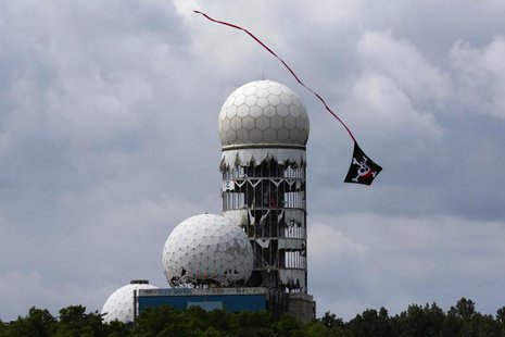 A kite flies near antennas of Former National Security Agency (NSA) listening station at the Teufelsberg hill (German for Devil's Mountain) A kite flies near antennas of Former National Security Agency (NSA) listening station at the Teufelsberg hill (German for Devil's Mountain)