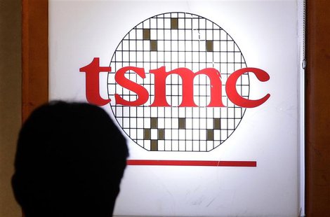 A man sits in front of the logo of Taiwan Semiconductor Manufacturing Co Ltd (TSMC) during an investors' conference in Taipei in this April A man sits in front of the logo of Taiwan Semiconductor Manufacturing Co Ltd (TSMC) during an investors' conference in Taipei in this April