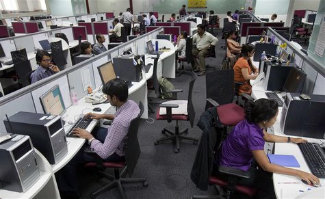 Employees are seen at their workstations on the floor of an outsourcing centre in Bangalore, in this file picture taken February 29, 2012. R Employees are seen at their workstations on the floor of an outsourcing centre in Bangalore, in this file picture taken February 29, 2012. R
