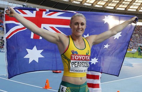 Sally Pearson of Australia holds her national flag after finishing second in the women's 100 metres hurdles final during the IAAF World Athl Sally Pearson of Australia holds her national flag after finishing second in the women's 100 metres hurdles final during the IAAF World Athl