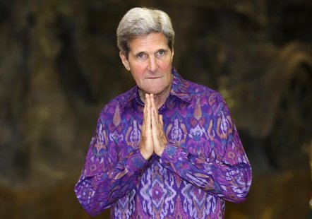 U.S. Secretary of State John Kerry gestures as he arrives for the Asia-Pacific Economic Cooperation (APEC) Summit official dinner in Nusa Du U.S. Secretary of State John Kerry gestures as he arrives for the Asia-Pacific Economic Cooperation (APEC) Summit official dinner in Nusa Du