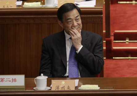 Former China's Chongqing Municipality Communist Party Secretary Bo Xilai reacts as he attends the opening ceremony of the Chinese People's P Former China's Chongqing Municipality Communist Party Secretary Bo Xilai reacts as he attends the opening ceremony of the Chinese People's P