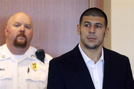 Aaron Hernandez, former player for the NFL's New England Patriots football team, stands during his arraignment in the Bristol County Superio Aaron Hernandez, former player for the NFL's New England Patriots football team, stands during his arraignment in the Bristol County Superio