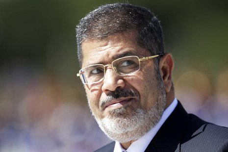 Egypt's President Mohamed Mursi reviews the troops in an official ceremony before a meeting with Brazil's President Dilma Rousseff at the Pl Egypt's President Mohamed Mursi reviews the troops in an official ceremony before a meeting with Brazil's President Dilma Rousseff at the Pl