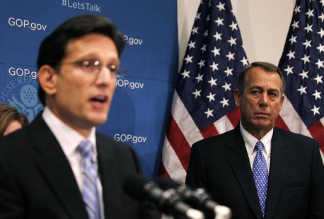U.S. House Speaker John Boehner (R-OH) watches as House Majority Leader Eric Cantor (R-VA) addresses the press following a House Republican U.S. House Speaker John Boehner (R-OH) watches as House Majority Leader Eric Cantor (R-VA) addresses the press following a House Republican