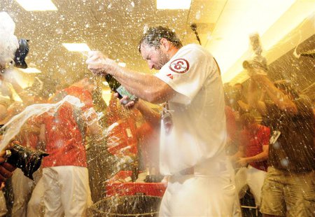 Oct 9, 2013; St. Louis, MO, USA; St. Louis Cardinals starting pitcher Adam Wainwright (50) celebrates with teammates after game five of the Oct 9, 2013; St. Louis, MO, USA; St. Louis Cardinals starting pitcher Adam Wainwright (50) celebrates with teammates after game five of the