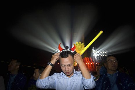 Jonathan Lu, new chief executive of Alibaba Group, puts on a headband with horns during the celebration of the 10th anniversary of Taobao Ma Jonathan Lu, new chief executive of Alibaba Group, puts on a headband with horns during the celebration of the 10th anniversary of Taobao Ma