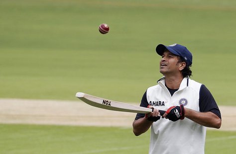 India's Sachin Tendulkar bounces a ball on his bat during a practice session ahead of their second test cricket match against New Zealand in India's Sachin Tendulkar bounces a ball on his bat during a practice session ahead of their second test cricket match against New Zealand in