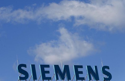 The company logo of Siemens AG is pictured atop an office building in Berlin September 30, 2013. REUTERS/Tobias Schwarz The company logo of Siemens AG is pictured atop an office building in Berlin September 30, 2013. REUTERS/Tobias Schwarz