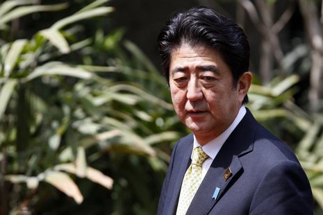 Japan's Prime Minister Shinzo Abe arrives for the family photo at the Asia-Pacific Economic Cooperation (APEC) Summit in Nusa Dua, on the In Japan's Prime Minister Shinzo Abe arrives for the family photo at the Asia-Pacific Economic Cooperation (APEC) Summit in Nusa Dua, on the In