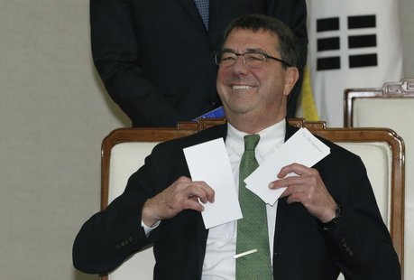 U.S. Deputy Secretary of Defence Ashton Carter holds letters before talks with South Korean Defence Minister Kim Kwan-jin (not pictured) at U.S. Deputy Secretary of Defence Ashton Carter holds letters before talks with South Korean Defence Minister Kim Kwan-jin (not pictured) at