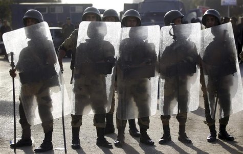 Egyptian soldiers stand guard near Rabaa al-Adawiya square during a protest by members of the Muslim Brotherhood and supporters of ousted Eg Egyptian soldiers stand guard near Rabaa al-Adawiya square during a protest by members of the Muslim Brotherhood and supporters of ousted Eg
