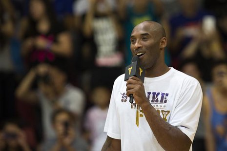 Los Angeles Lakers NBA star Kobe Bryant speaks to fans while attending a youth basketball final match in Hong Kong August 3, 2013. REUTERS/T Los Angeles Lakers NBA star Kobe Bryant speaks to fans while attending a youth basketball final match in Hong Kong August 3, 2013. REUTERS/T