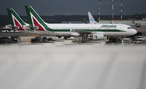 Alitalia planes are parked on the tarmac at Fiumicino international airport in Rome October 11, 2013. REUTERS/Tony Gentile Alitalia planes are parked on the tarmac at Fiumicino international airport in Rome October 11, 2013. REUTERS/Tony Gentile