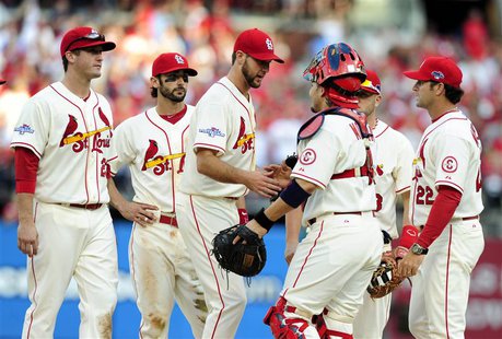 Oct 12, 2013; St. Louis, MO, USA; St. Louis Cardinals manager Mike Matheny (middle) is congratulated by catcher Yadier Molina (4) as he is r Oct 12, 2013; St. Louis, MO, USA; St. Louis Cardinals manager Mike Matheny (middle) is congratulated by catcher Yadier Molina (4) as he is r