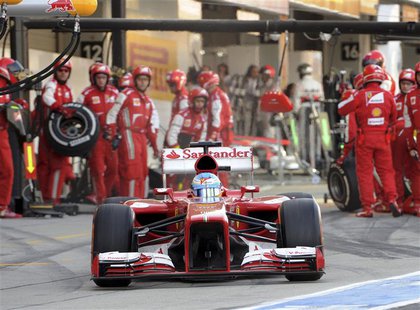 Ferrari Formula One driver Fernando Alonso of Spain leaves the pit during the Japanese F1 Grand Prix at the Suzuka circuit in Japan October Ferrari Formula One driver Fernando Alonso of Spain leaves the pit during the Japanese F1 Grand Prix at the Suzuka circuit in Japan October